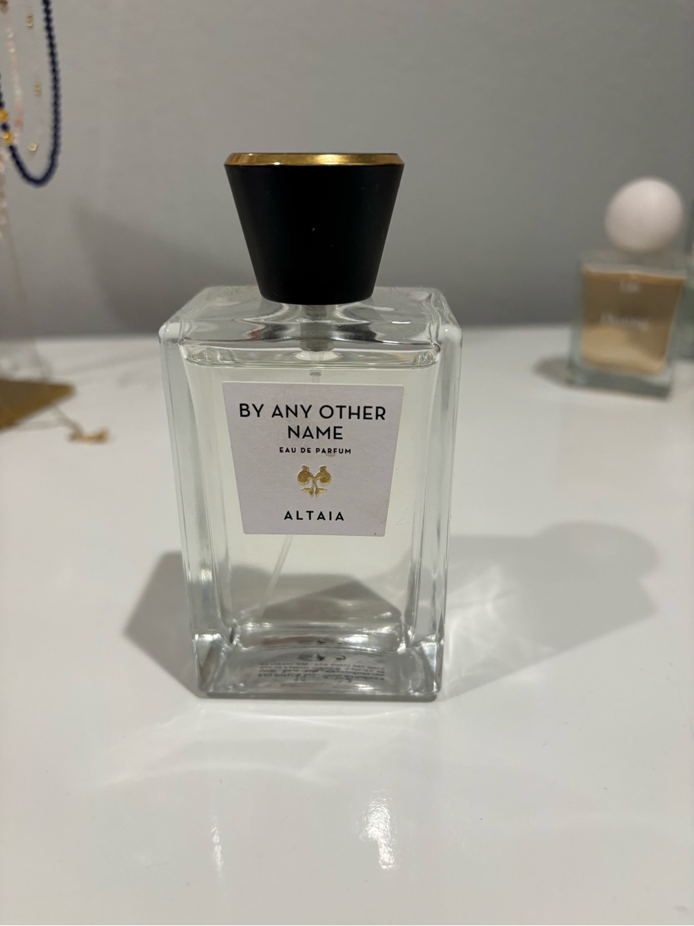 Alaia Clear Glass Bottle with Black and Gold Cap